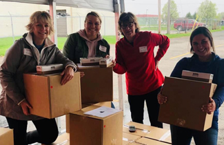 women holding boxes